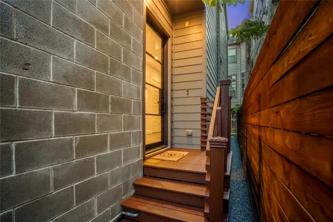 a kitchen with kitchen island granite countertop a stove and a refrigerator