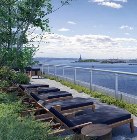 a view of a patio with table and chairs and potted plants