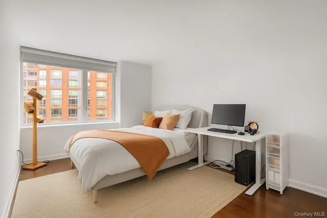 a kitchen with granite countertop a sink stove and refrigerator