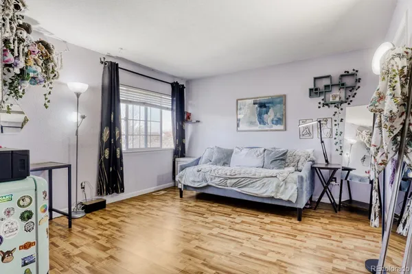a bedroom with furniture and window