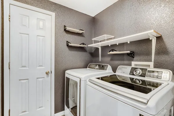 a utility room with dryer and washer