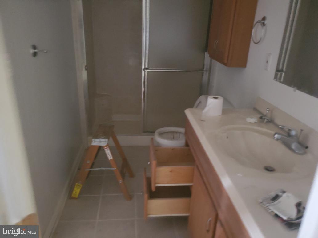 12408 West Old Baltimore Road Boyds, MD 20841 - Photo 11 of 13 a bathroom with a sink and a tub