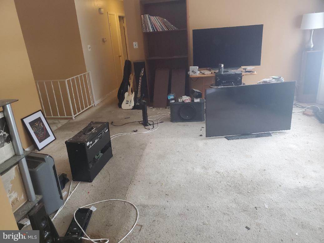 12408 West Old Baltimore Road Boyds, MD 20841 - Photo 2 of 13 a living room with furniture and a flat screen tv