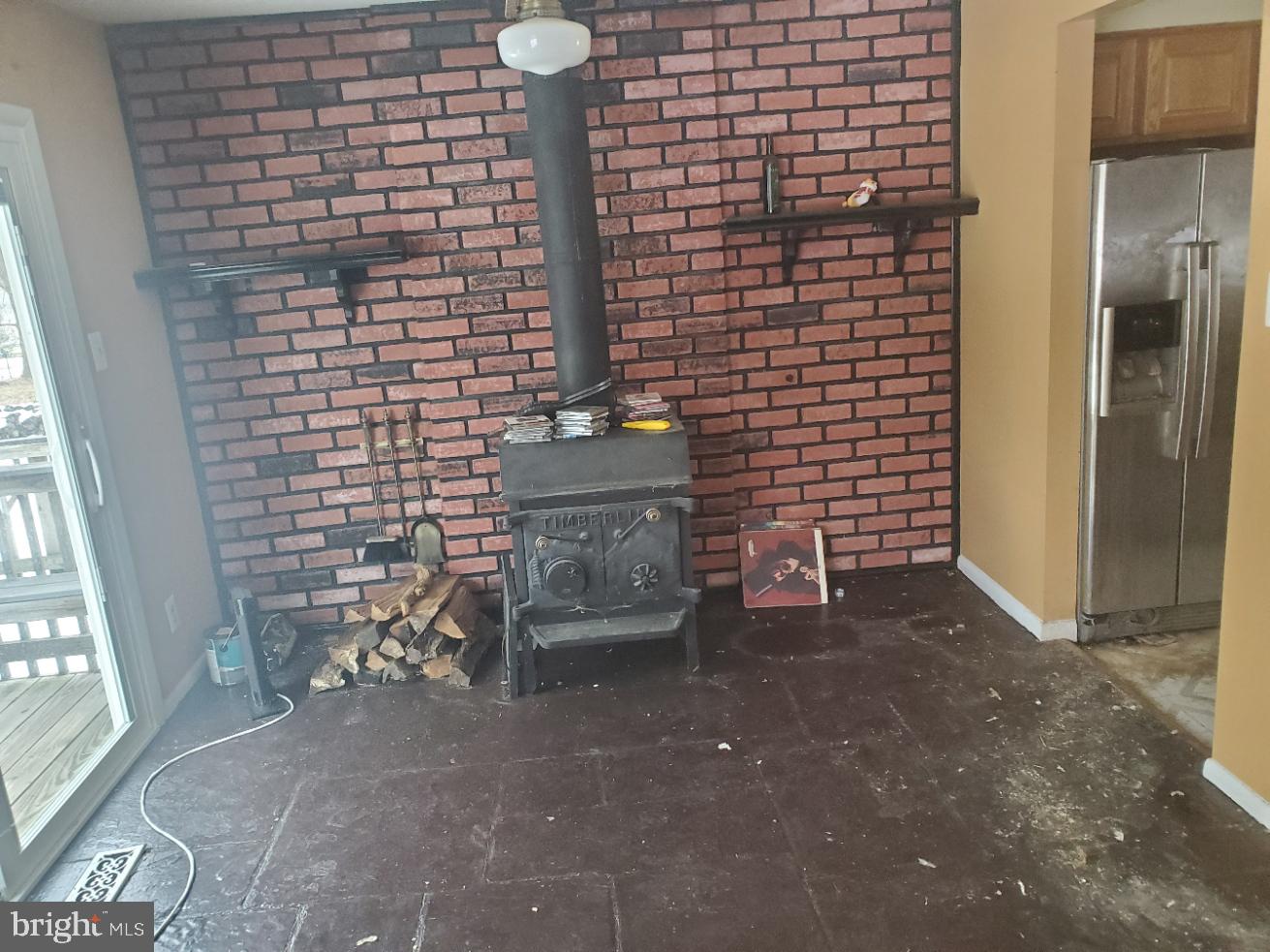12408 West Old Baltimore Road Boyds, MD 20841 - Photo 5 of 13 a view of empty room with fireplace