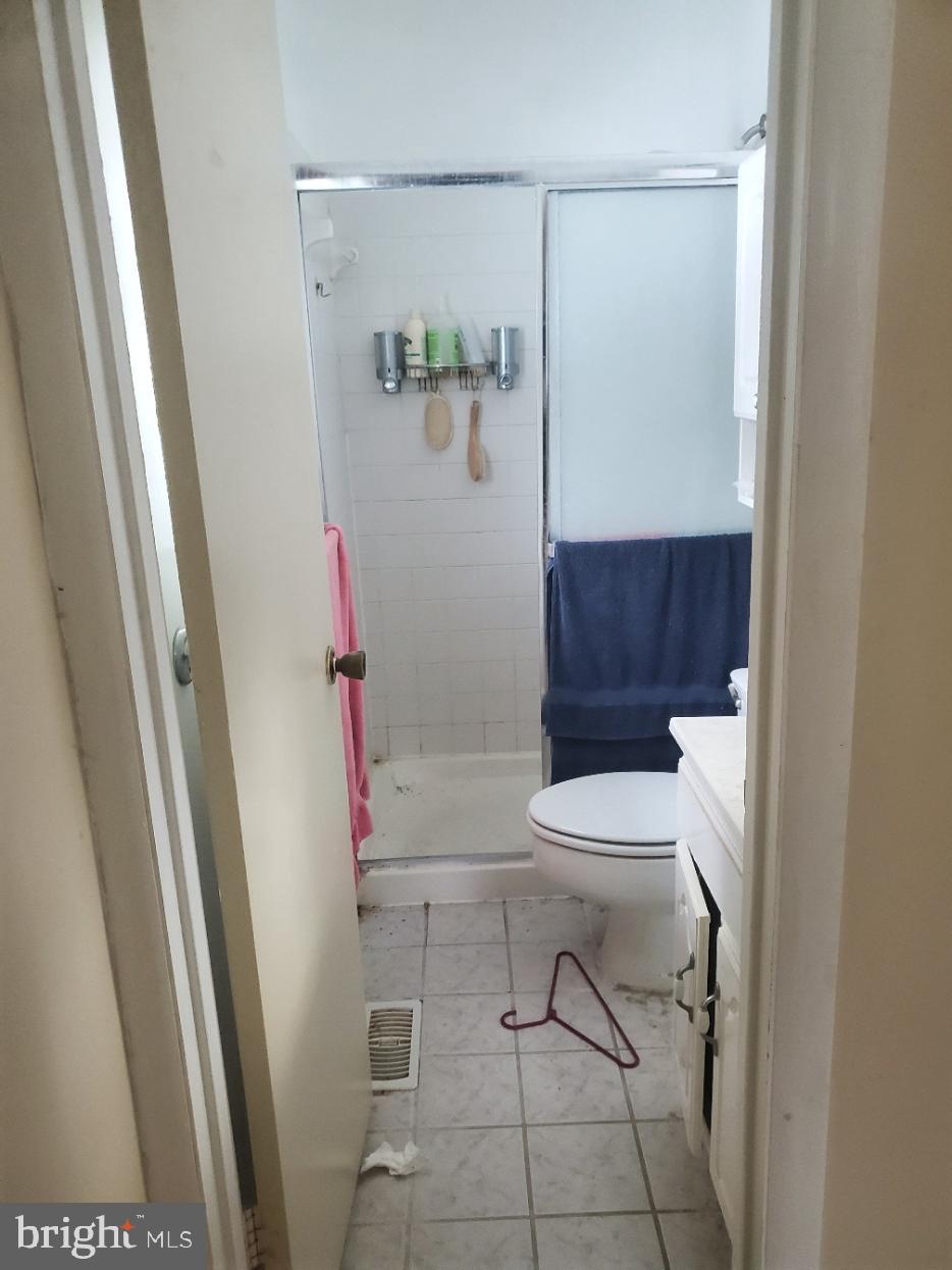 12408 West Old Baltimore Road Boyds, MD 20841 - Photo 9 of 13 a bathroom with a toilet and a shower