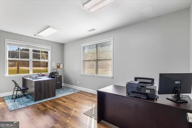 a workspace with furniture and a window