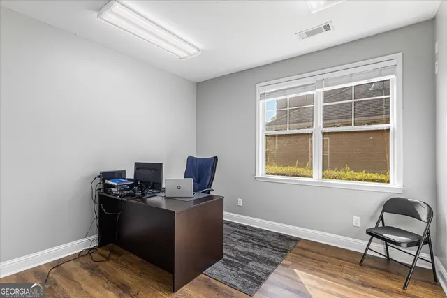 a workspace with furniture and a window