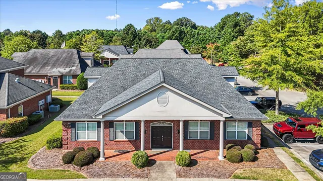 front view of a house with a small yard