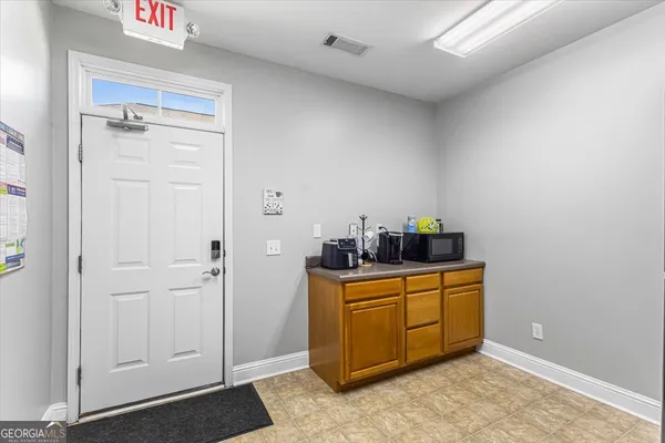 a view of a storage & utility room with closet