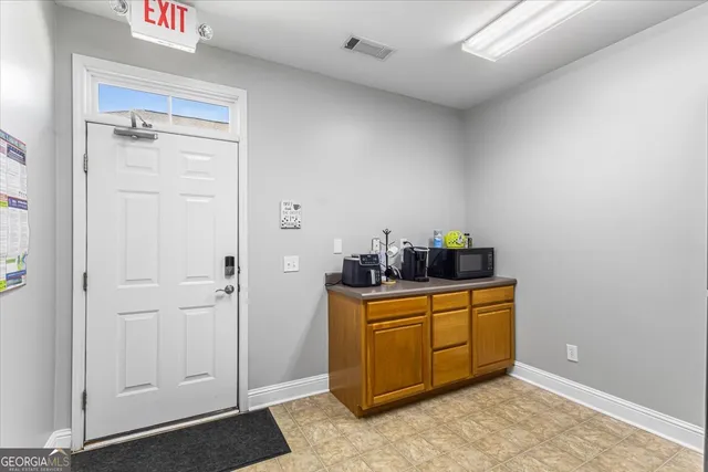 a view of a storage & utility room with closet