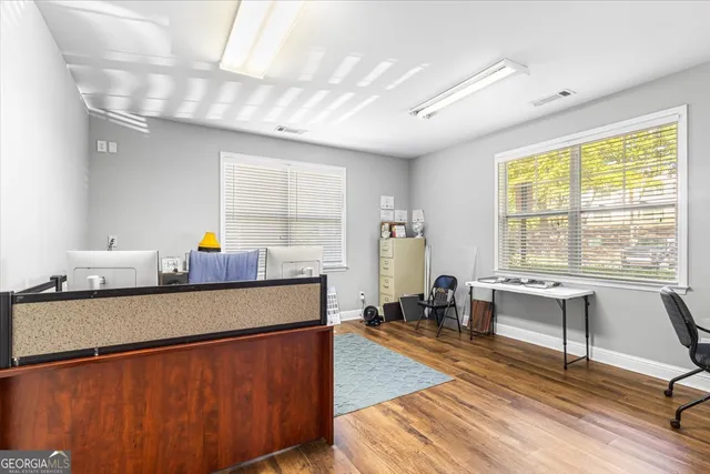 a living room with furniture a window and a table
