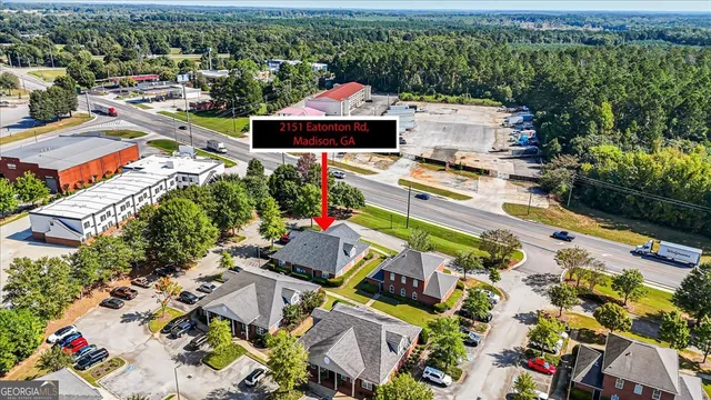 an aerial view of residential houses with outdoor space