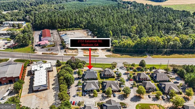 an aerial view of a house with a swimming pool