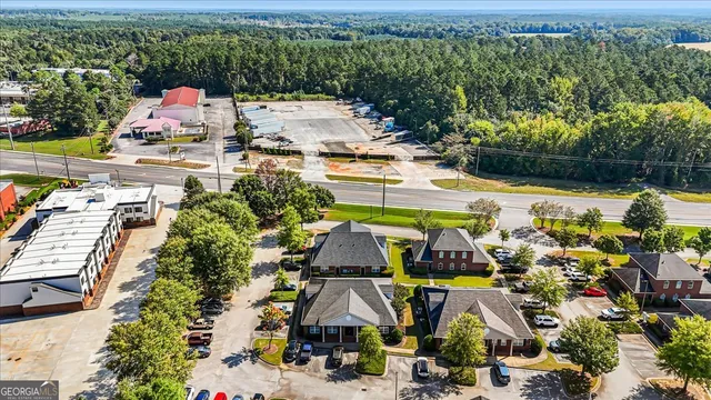 an aerial view of houses with yard