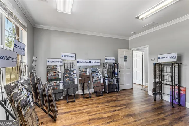 a view of a room with lots of wooden furniture