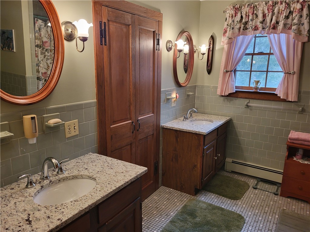 276 Widow Sweets Road Exeter, RI 02822 - Photo 24 of 44 Large main bath has tiled shower stall, double vanities/granite, linen closet