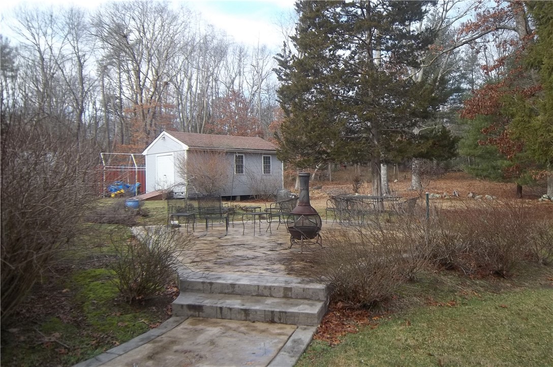 276 Widow Sweets Road Exeter, RI 02822 - Photo 41 of 44 Enjoy the rear patio perfect for entertaining or relazing by the fire. There is also a large separate storage shed with power.