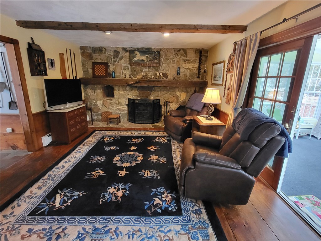 276 Widow Sweets Road Exeter, RI 02822 - Photo 8 of 44 Great fieldstone fireplace & sliders to the sun room