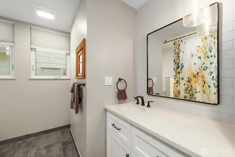 a bedroom with bed and glass door