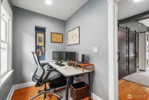 a bedroom with furniture and a window