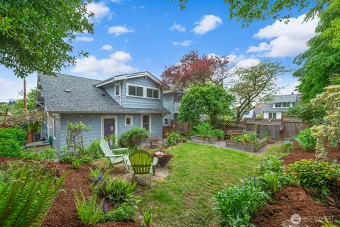 a view of yard with green space and seating area