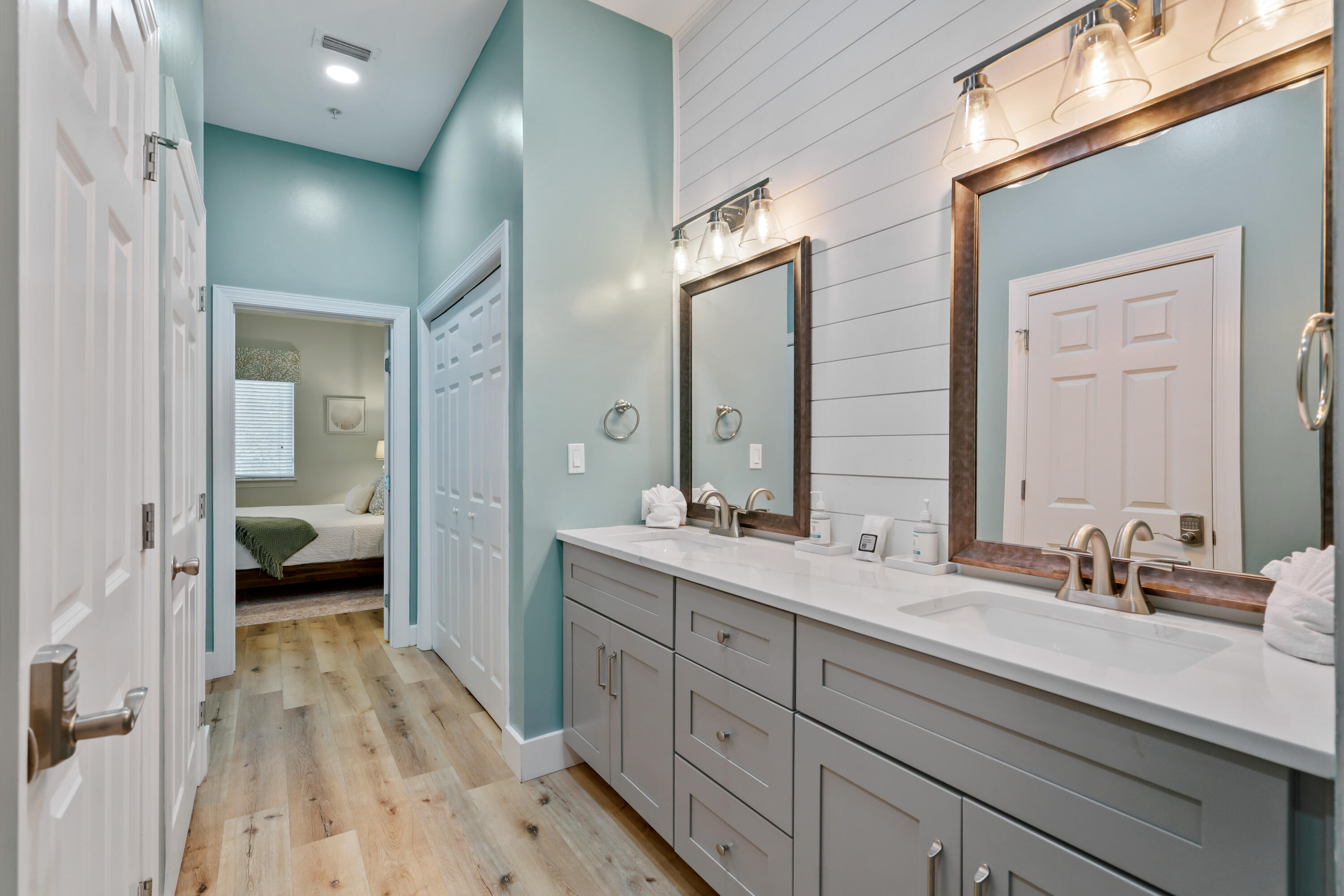 231 Somerset Bridge Road, Unit 2305 Santa Rosa Beach, FL 32459 - Photo 16 of 40 a en suite bathroom with a double vanity sink and mirror