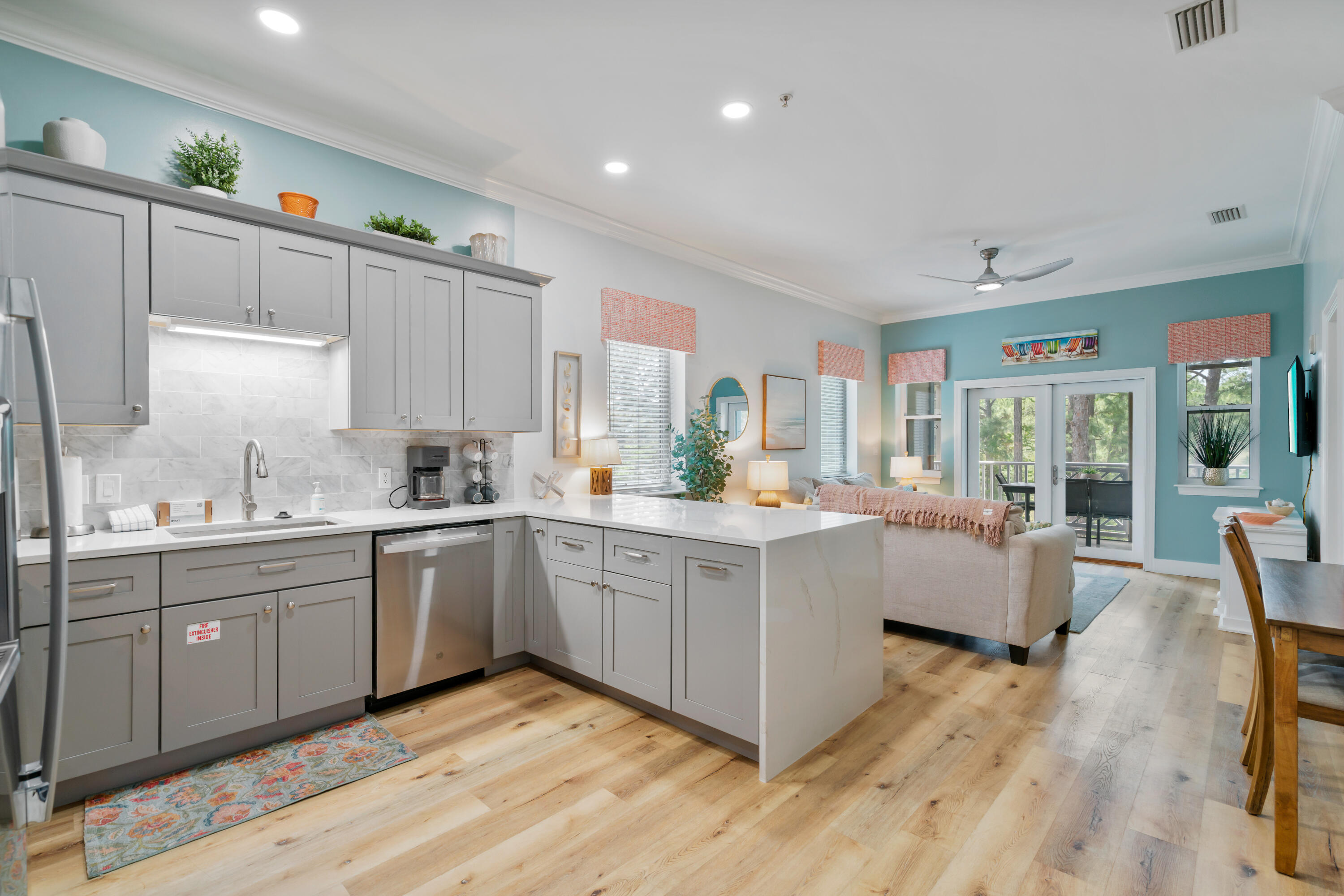 231 Somerset Bridge Road, Unit 2305 Santa Rosa Beach, FL 32459 - Photo 9 of 40 a kitchen with sink cabinets and wooden floor