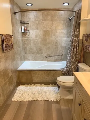 a bathroom with a sink a mirror and a shower