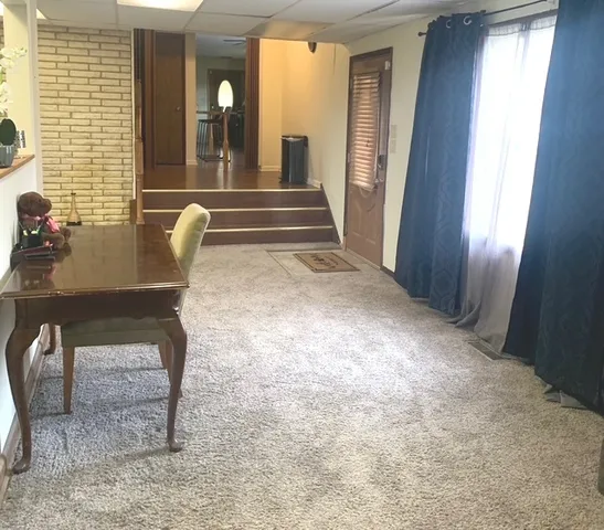 a view of front door with furniture