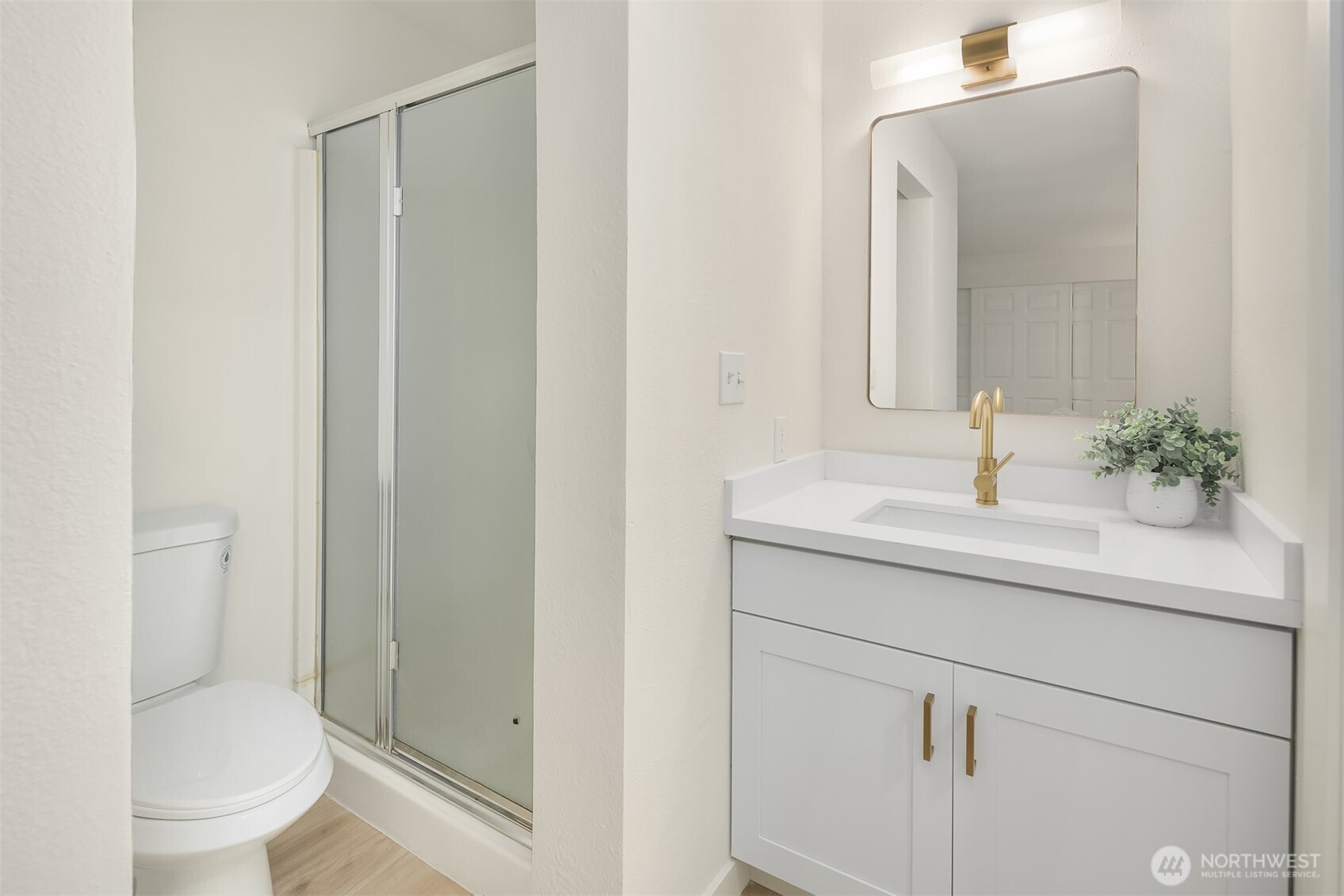 14415 Northeast 30th Place, Unit 22A Bellevue, WA 98007 - Photo 20 of 30 a bathroom with a sink a toilet and shower
