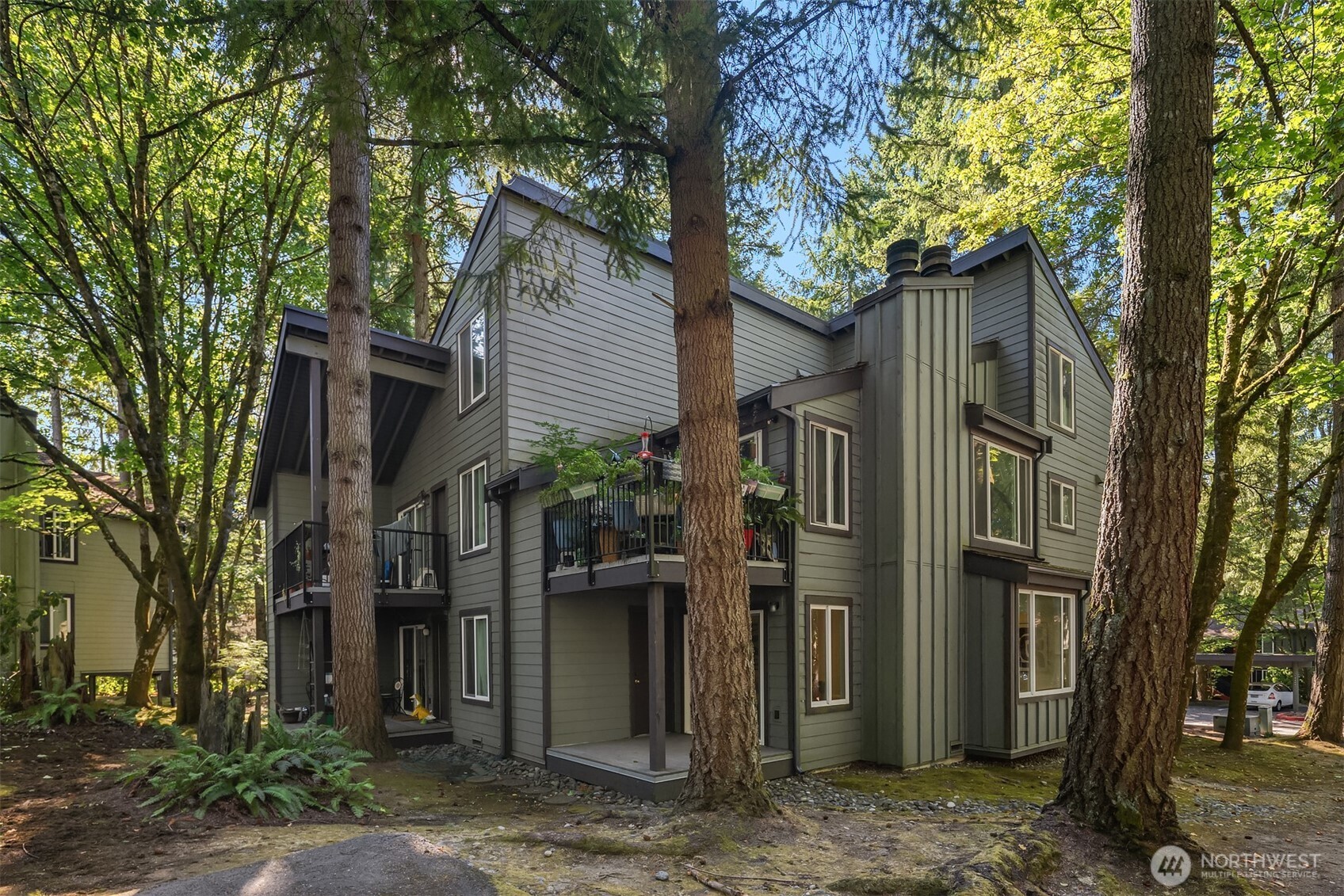 14415 Northeast 30th Place, Unit 22A Bellevue, WA 98007 - Photo 25 of 30 a view of a house with a tree