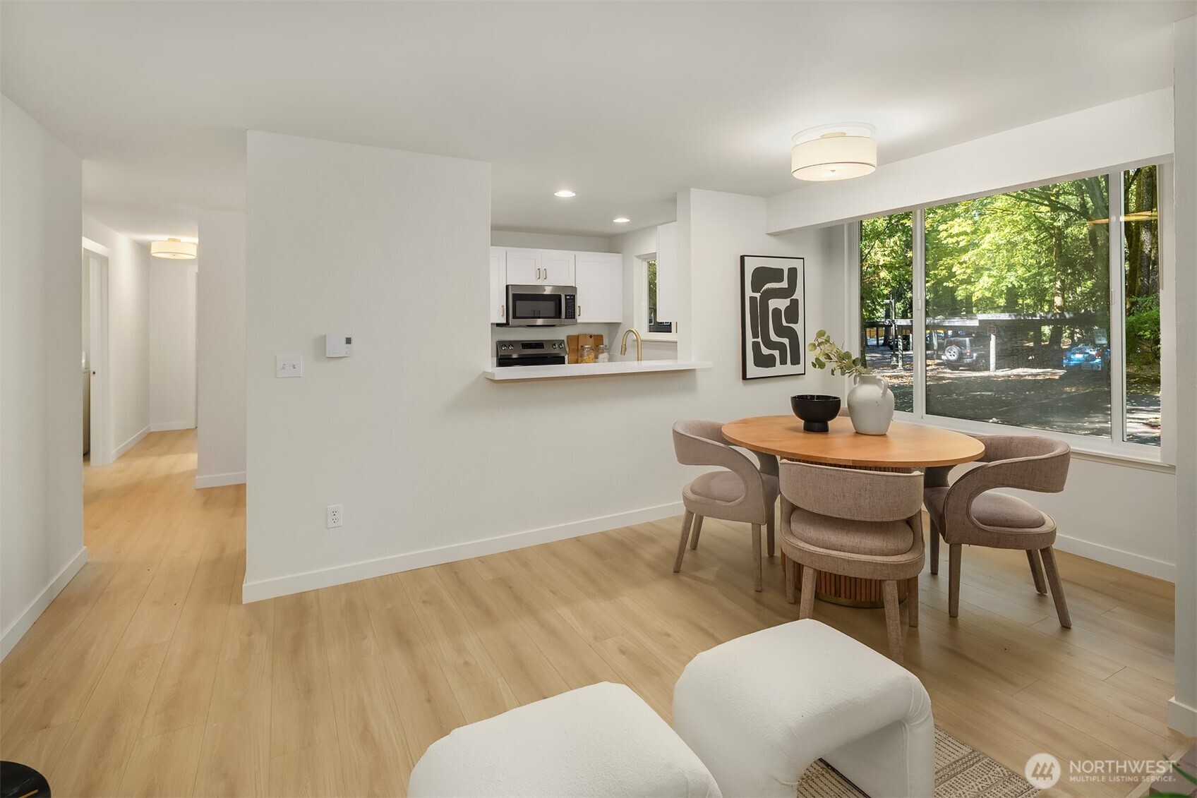 14415 Northeast 30th Place, Unit 22A Bellevue, WA 98007 - Photo 8 of 30 a dining room with furniture and wooden floor