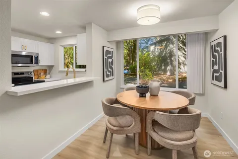 a dining room with furniture and window