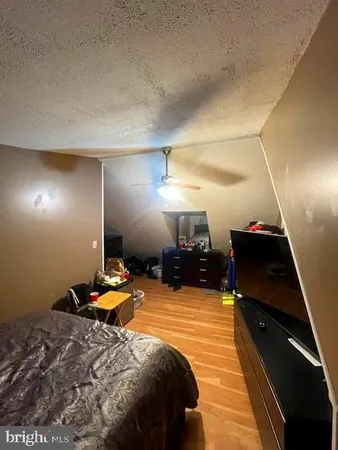 a bed room with a bed and a television