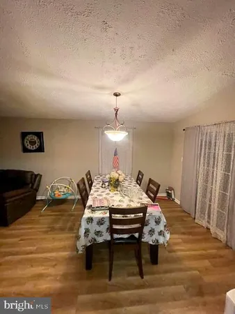 a bed sitting in a room and a mirror