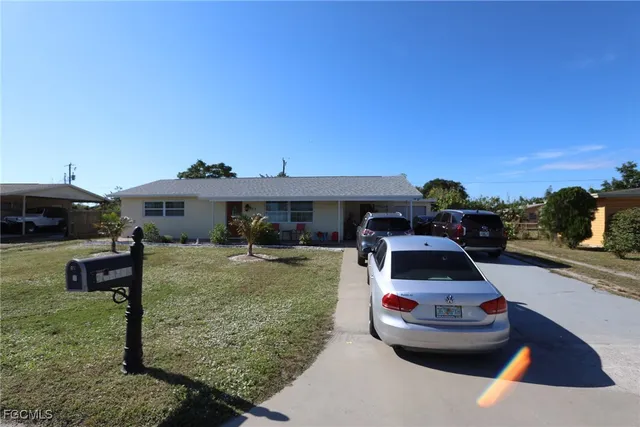 a car parked in front of a house