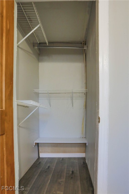 907 Laredo Avenue Lehigh Acres, FL 33936 - Photo 13 of 13 a view of walk in closet with empty racks