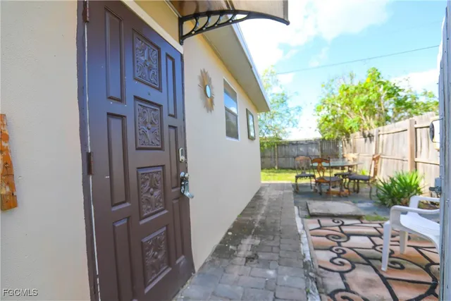 a view of a backyard with sitting area