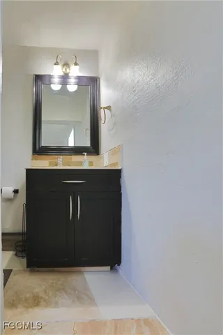 a view of a livingroom with kitchen countertops and wooden floor