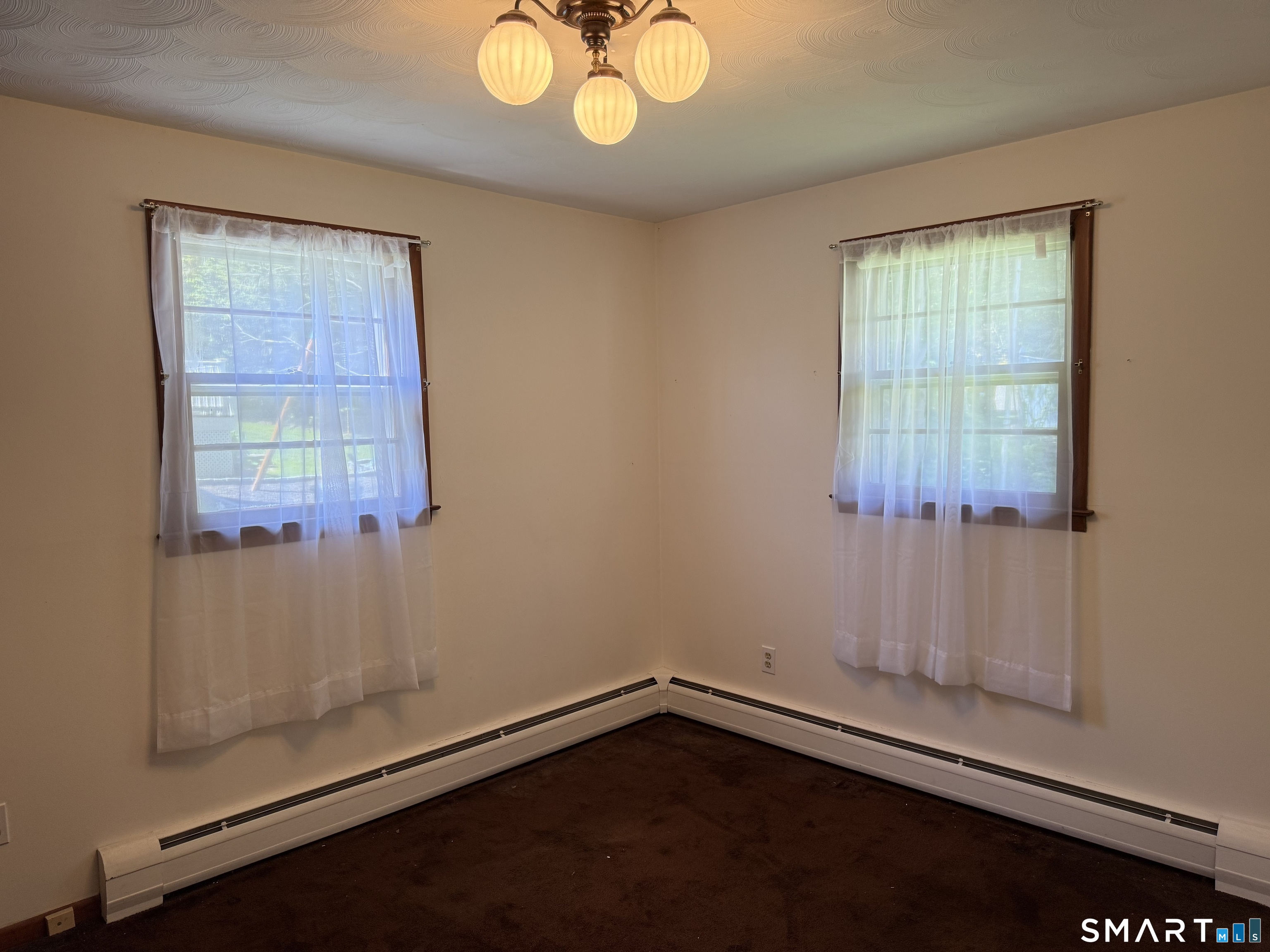 26 Maple Street Trumbull, CT 06611 - Photo 24 of 37 an empty room with windows
