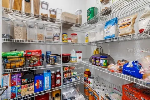 a store room with lots of clutter and flowers