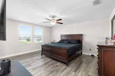 a bedroom with a bed and window