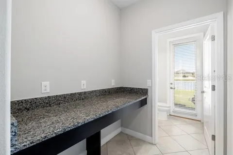 a view of a house with swimming pool and yard