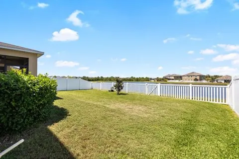 a view of a house with a yard and garage