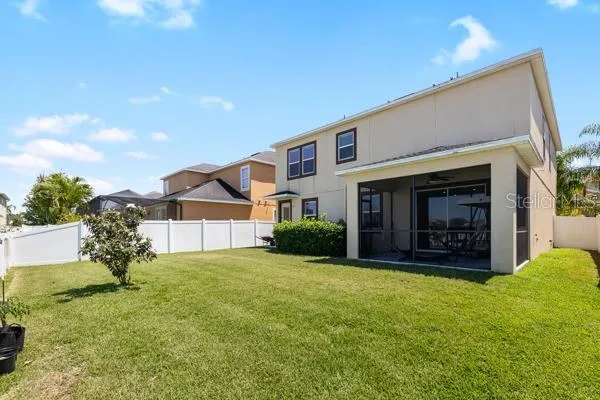 a view of a living room with a floor to ceiling window and stairs