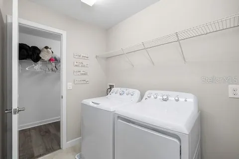 an aerial view of lake and residential houses with outdoor space