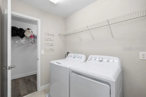 an aerial view of lake and residential houses with outdoor space