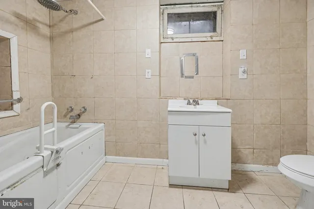 a bathroom with a sink toilet and vanity