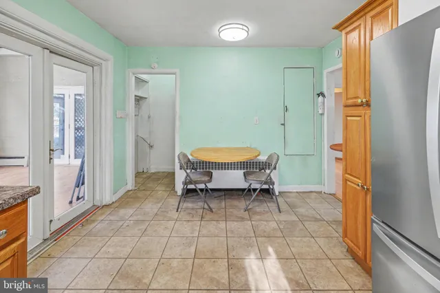 a spacious bathroom with a mirror and a shower