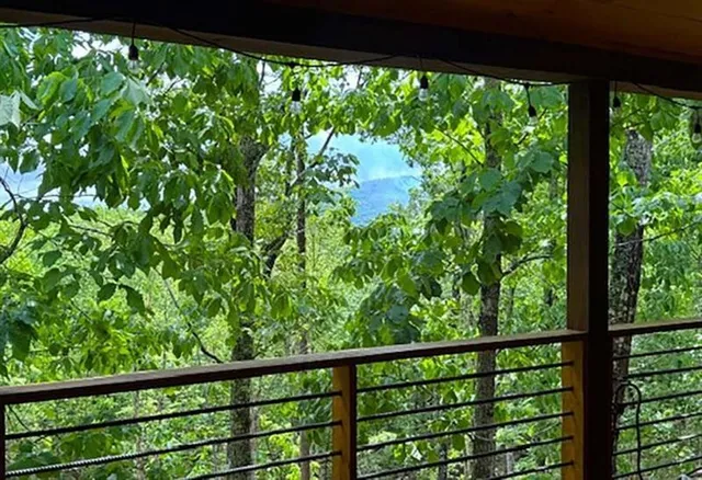 a view of a green yard from a balcony
